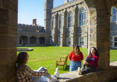 Students sitting and talking in the Cloisters